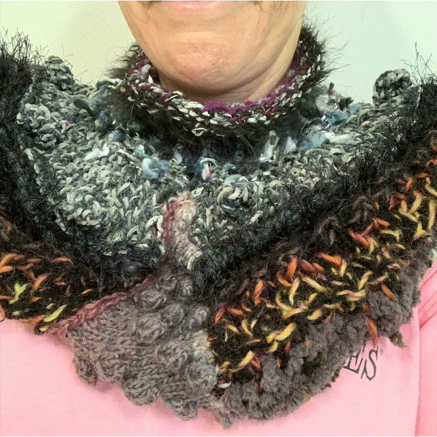 Hand knit in one piece soft infinity shoulder wrap adornment with multiple stitch and color textures. Winter scarf.