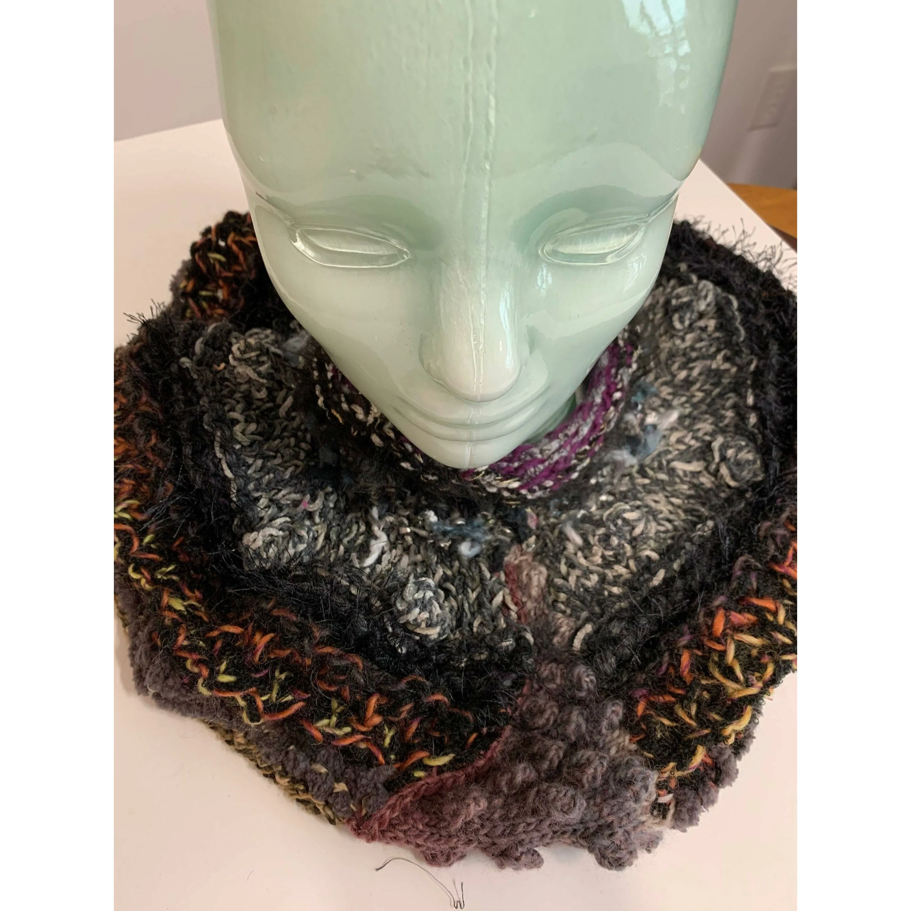 Hand knit in one piece soft infinity shoulder wrap adornment with multiple stitch and color textures. Winter scarf.